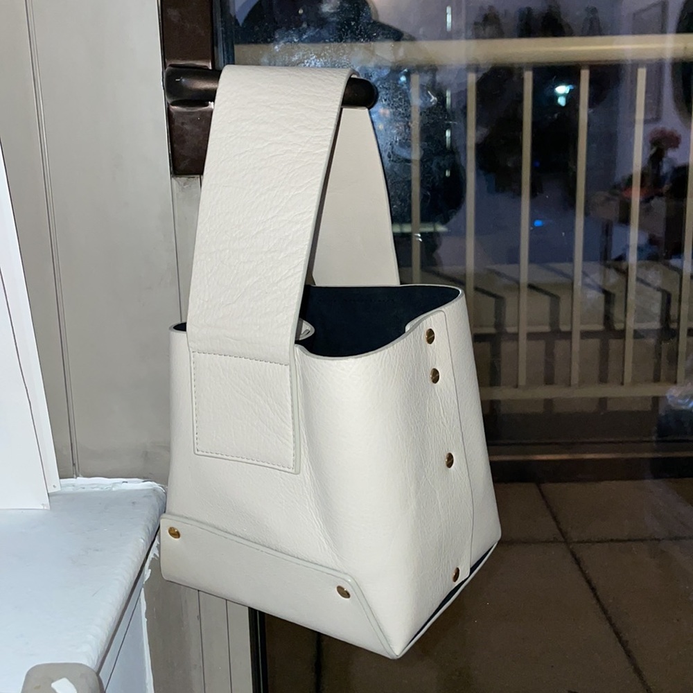 Yuzefi leather tab bag in off white with gold hardware